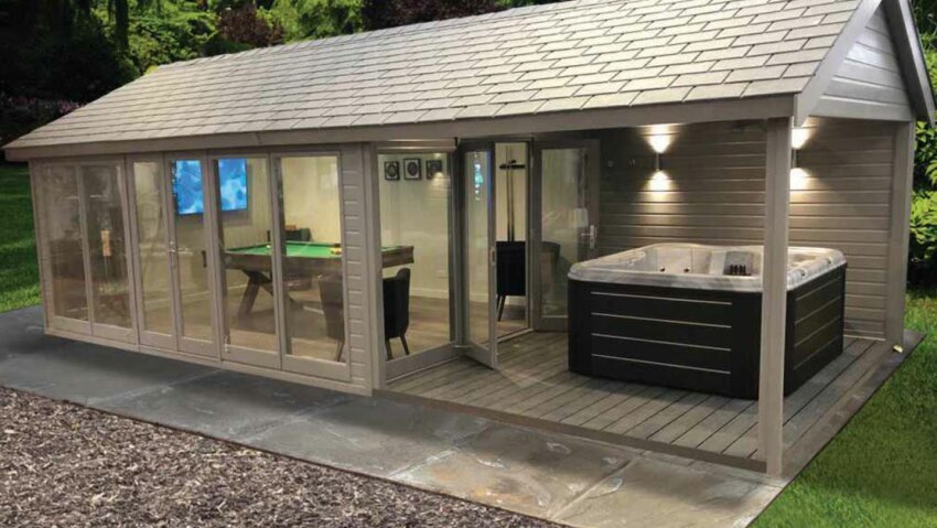 A garden shed with a billiards setup and an outdoor hot tub